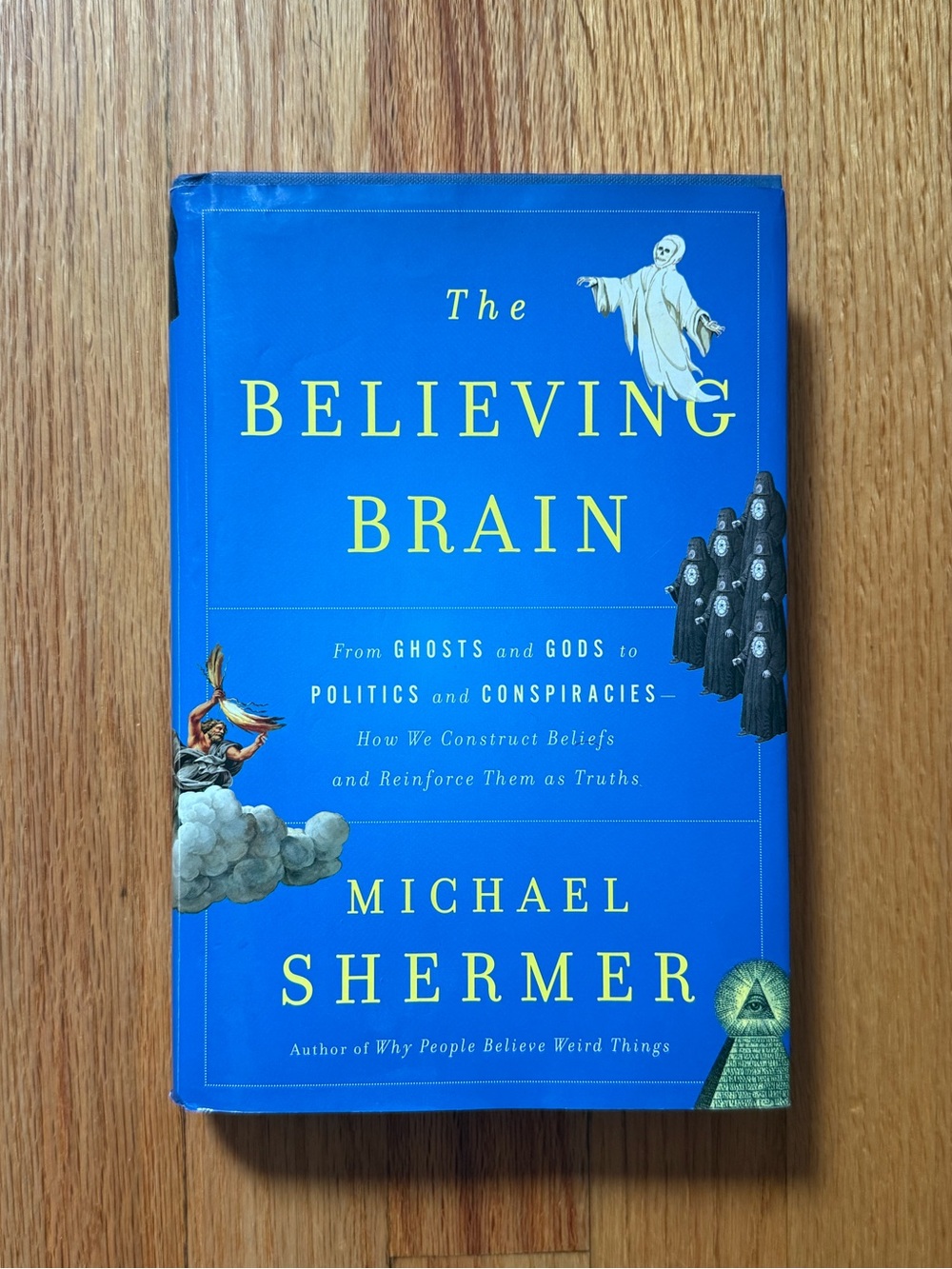 The Believing Brain by Michael Shermer - Bright Blue Hardcover